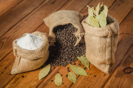 Salt, pepper and bay leaf in pouchesの写真素材