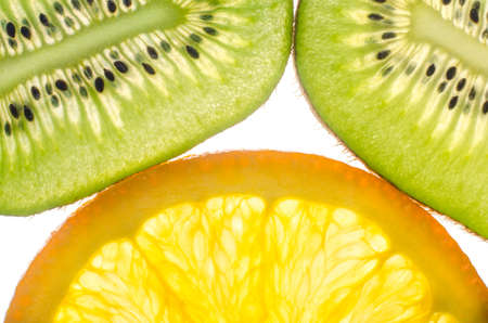 kiwi fruit, orange in a cut white background.の写真素材