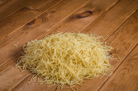 Pasta on a wooden table.の写真素材