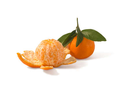 Tangerines with green leaves on a white background.の写真素材