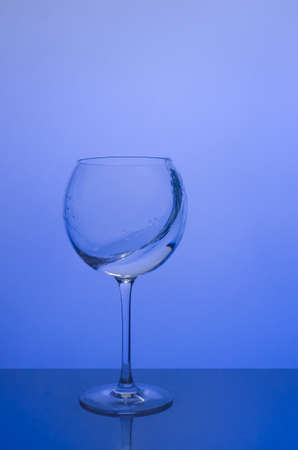 Water splash in round glass.の写真素材