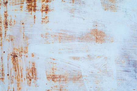 Old paint on rusty metal texture.の写真素材