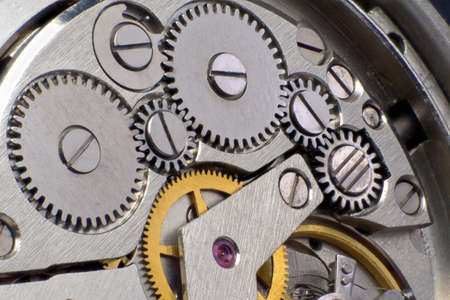 Metal gears of old clock mechanism.
