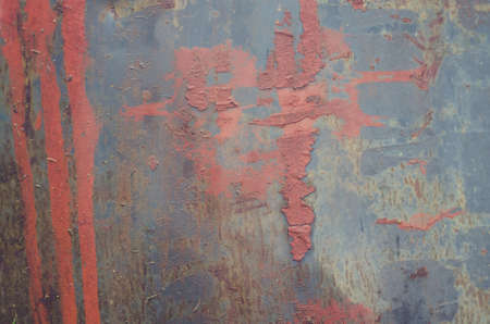 Old paint on rusty metal texture.の写真素材