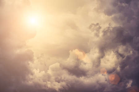 Beautiful sky with storm clouds and sunlight.の写真素材