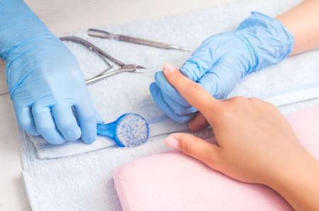 The master prepares the nails for manicure.の写真素材