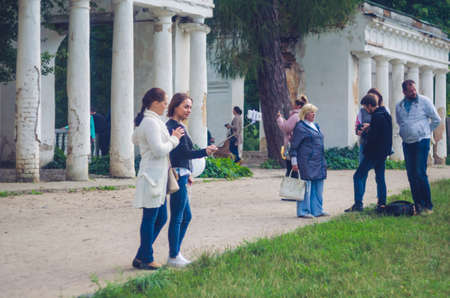 24 august 2017 Ukraine, White Church. Two girls do selfie on mobile phone near ruins.