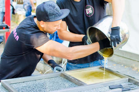 26 august 2017 Ukraine, White Church. The process of caramel cooking outdoors.のeditorial素材