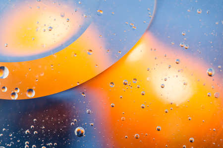Oil drops on water surface abstract background.の写真素材