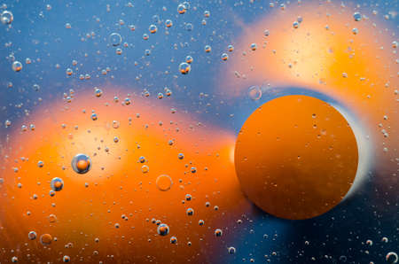 Oil drops on water surface abstract background.の写真素材