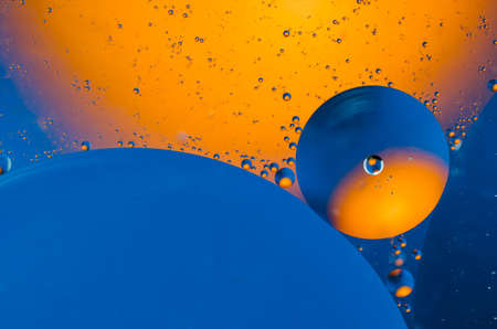 Oil drops on water surface abstract background.の写真素材