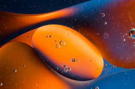 Oil drops on water surface abstract background.の写真素材