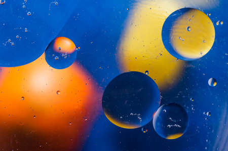 Oil drops on water surface abstract background.の写真素材