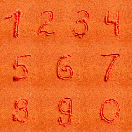 Number written on orange sand.の写真素材
