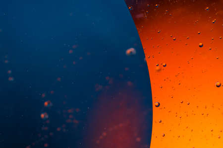 Oil drops on water surface abstract background.