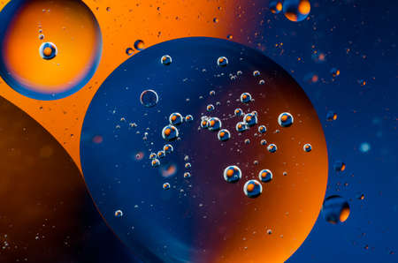 Oil drops on water surface abstract background.の写真素材