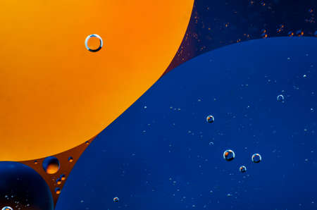 Oil drops on water surface abstract background.の写真素材