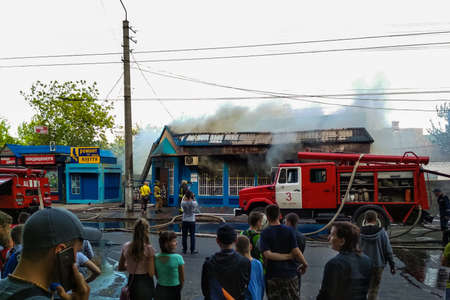 Belaya Tserkov, Ukraine, May 8, 2018: The burning of a shop on the city street. Extinguishing the...