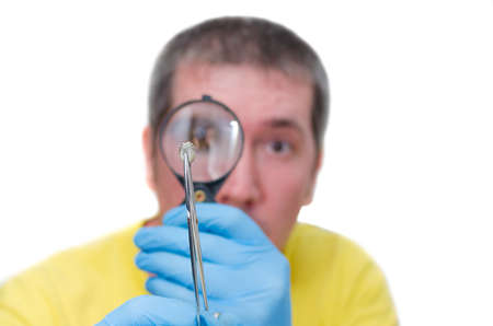 Man looking at mite through magnifier, isolated on white background.