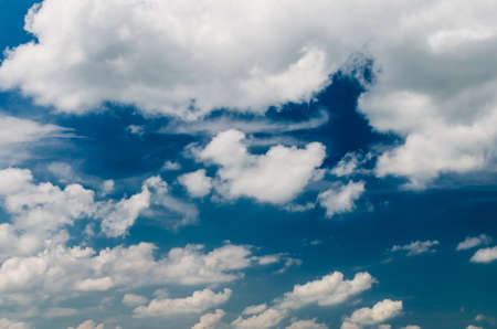 Beautiful fluffy clouds against the blue sky.の写真素材