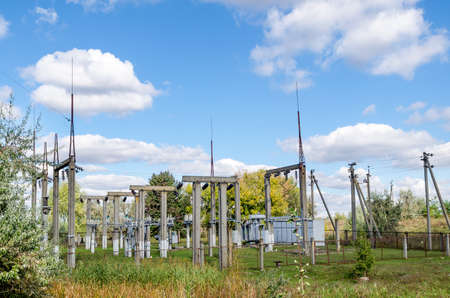 Distribution electric substation with power lines and transformers.