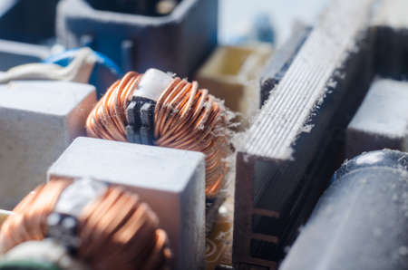 A thick layer of dust covers the internal electronic components of the computer.の写真素材