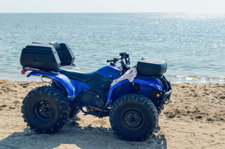 Atv on the sand by the sea.