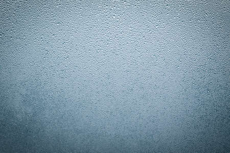 Misted wet window glass as background texture.