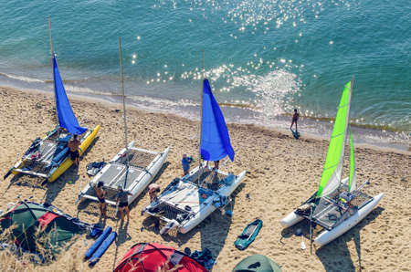 Sanzhejka, Ukraine, August 05, 2018: preparation of sailing catamarans to go to sea on a sandy beachのeditorial素材