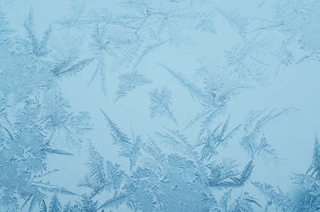 Abstract frosty pattern on glass, background texture.の写真素材