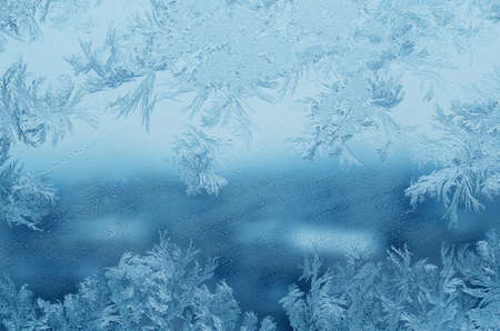 Abstract frosty pattern on glass, background texture.