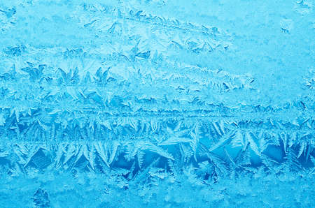 Abstract frosty pattern on glass, background texture.