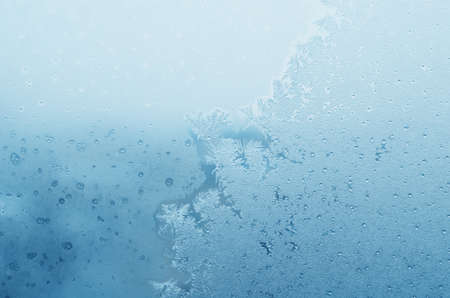 Abstract frosty pattern on glass, background texture.