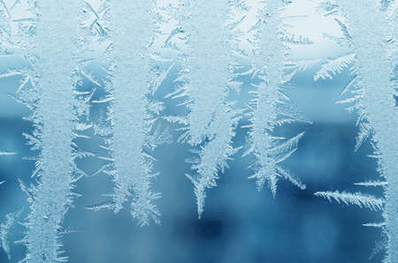 Abstract frosty pattern on glass, background texture.の写真素材