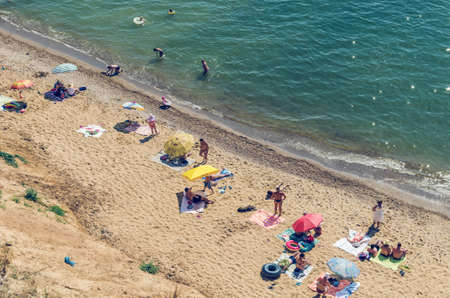 Sanzhejka, Ukraine, August 05 2018: People bathe and sunbathe on the beachのeditorial素材
