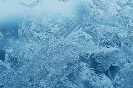 Abstract frosty pattern on glass, background texture.の写真素材