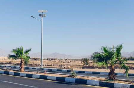 High poles with lanterns on top, street lamp along the road in Egypt, Sharm El Sheikh.の写真素材