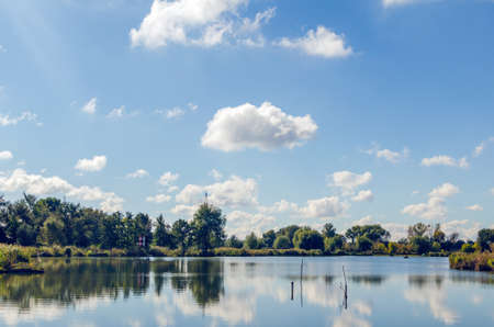 Beautiful summer landscape with a river and blue skyの写真素材