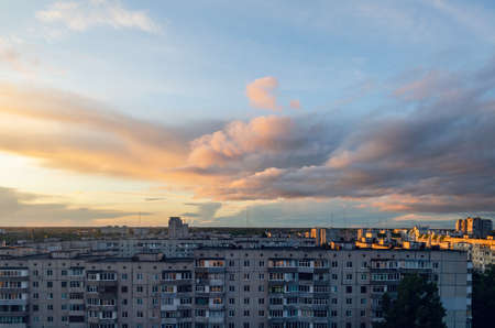 Beautiful clouds during sunset over the city, cityscape.の写真素材