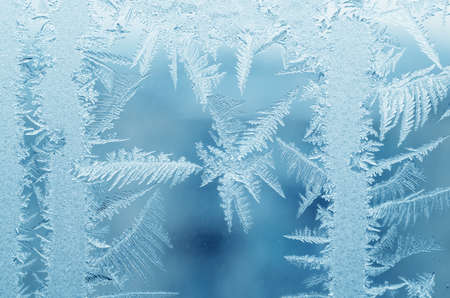 Abstract frosty pattern on glass, background texture.