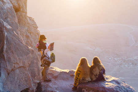 Sinai Peninsula, Egypt, May 9, 2019. Girls greet dawn and take pictures on Mount Moses, Sinai...