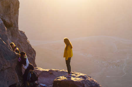 Sinai Peninsula, Egypt, May 9, 2019: Pilgrims meet the dawn on the Moses Mountain, Sinai Peninsula, Egypt