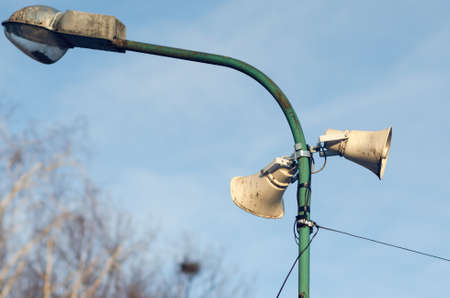 Old outdoor street loudspeaker for public announcements.