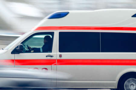 Ambulance car in the city, motion blur.の写真素材