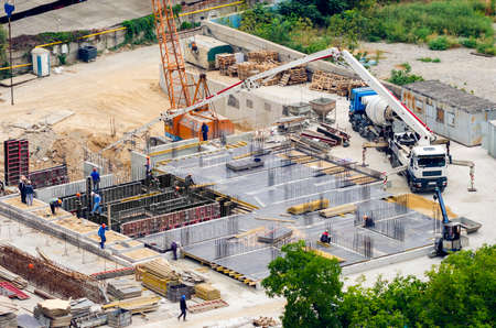 Aerial view of construction site, construction of new building in residential area.