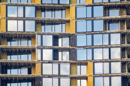 Facade of a multi-storey building under construction.の写真素材