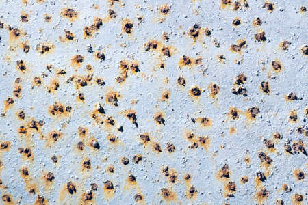 Rusty metal wall with cracked paint, background texture.の写真素材