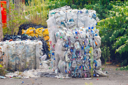Plastic bottles pressed into bales, preparation for processing.の写真素材