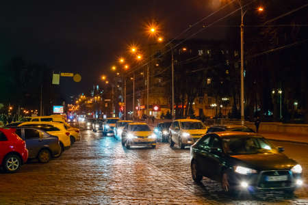 Kharkiv Ukraine, February 22, 2020: cars driving in the night city.の写真素材