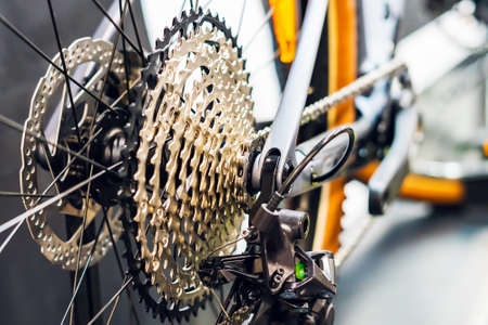 Bicycle cassette sprocket rear wheel closeup, background texture.